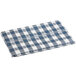 A folded navy blue and white checkered vinyl table cover with a flannel back.