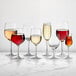 A group of Della Luce Maia Bordeaux wine glasses on a white background, one filled with red wine and one filled with white wine.