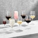 A group of Della Luce Maia Bordeaux wine glasses on a marble table.