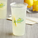 A clear plastic cup filled with ice-cold lemonade, featuring a printed 'Lemonade' logo on the front.