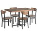 A Lancaster Table & Seating wood table with a butcher block top and metal frame with four boomerang chairs.