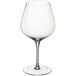 A close-up of a clear Della Luce Maia burgundy wine glass with a stem.