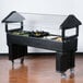 A black food display with a clear cover (Carlisle 660603 Six Star Open Base Portable Food / Salad Bar)