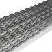 A Nemco scalloped blade with a pattern of waves on a metal surface.