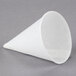 A close-up of a Genpak white cone-shaped paper cup.