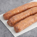 Warrington Farm Meats Hot Italian Sausage Links on white paper.