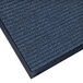 A close-up of a blue Lavex carpet mat with a black border.