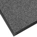 A close-up of a gray Lavex carpet mat with black trim.