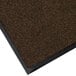 A close-up of a brown Lavex carpet with black trim.
