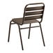 A brown metal Lancaster Table & Seating outdoor side chair with a wooden seat.
