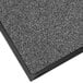 A close-up of a gray Lavex carpet mat with black trim.