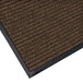 A brown Lavex Needle Rib indoor entrance mat with black trim.