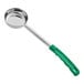 A silver portion spoon with a green handle.