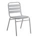 A Lancaster Table & Seating gray metal outdoor side chair with a white seat.