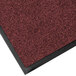 A red carpet mat with black border.