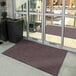 A red Lavex Plush Dilour indoor entrance mat.