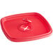A red plastic Noble Products King-Pail lid with a hole.