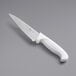 A Choice 6" serrated chef knife with a white handle.
