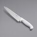 A close-up of a Choice 8" serrated chef knife with a white handle.