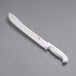 A Choice 12" butcher knife with a white handle on a gray surface.