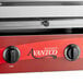 An Avantco electric countertop salamander with red and silver accents.
