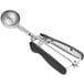 An OXO black and silver metal ice cream scoop with a squeeze handle.