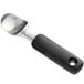 An OXO stainless steel ice cream scoop with a black handle and silver scoop.