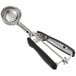 An OXO silver and black ice cream scoop with a squeeze handle and a plastic grip.