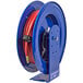 A blue Coxreels hose reel with a red hose attached.