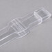Clear plastic tongs with a plastic handle.