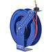 A blue Coxreels hose reel with a red hose attached.