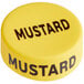 A mustard yellow silicone lid wrap with black text.