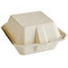 A Tellus Products natural bagasse clamshell container with a lid.