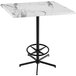 A white marble Holland Bar Table with black legs.