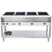 A Vollrath electric hot food table with a sealed well and four black square pans on a counter.