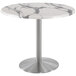 A white marble round Holland Bar Table with a stainless steel base.