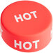 A red round silicone lid with white text reading "Hot"