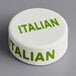 A white circular silicone lid with green text reading "Italian"