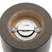 A close-up of a circular metal grinder.