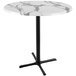 A white marble round Holland Bar Table with a black cross base.