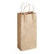 A close-up of a brown Choice paper bag with handles.