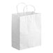 A close-up of a white Choice paper shopping bag with handles.