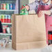 Choice 18" x 7" x 18 3/4" Natural Kraft Paper Customizable Shopping Bag with Handles - 200/Case Main Thumbnail 1