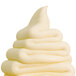 A close up of a white swirl of soft serve ice cream.