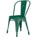 A green metal Lancaster Table & Seating outdoor cafe chair with a backrest.