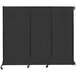 A black Versare wall-mounted room divider with wheels.
