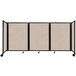 A Versare beige SoundSorb folding room divider with four panels on wheels.