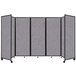 A Versare Cloud Gray foldable room divider on wheels.