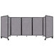 A Versare Cloud Gray foldable room divider with four panels and a black frame.