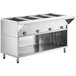 A stainless steel ServIt electric steam table on a school kitchen counter.